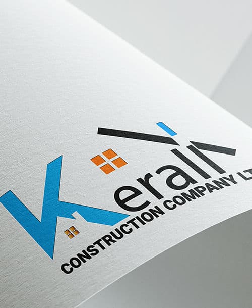 Kerali Construction Company logo printed on curved paper — a blue K built from a wall and a rooftop, with orange window panes set into it.