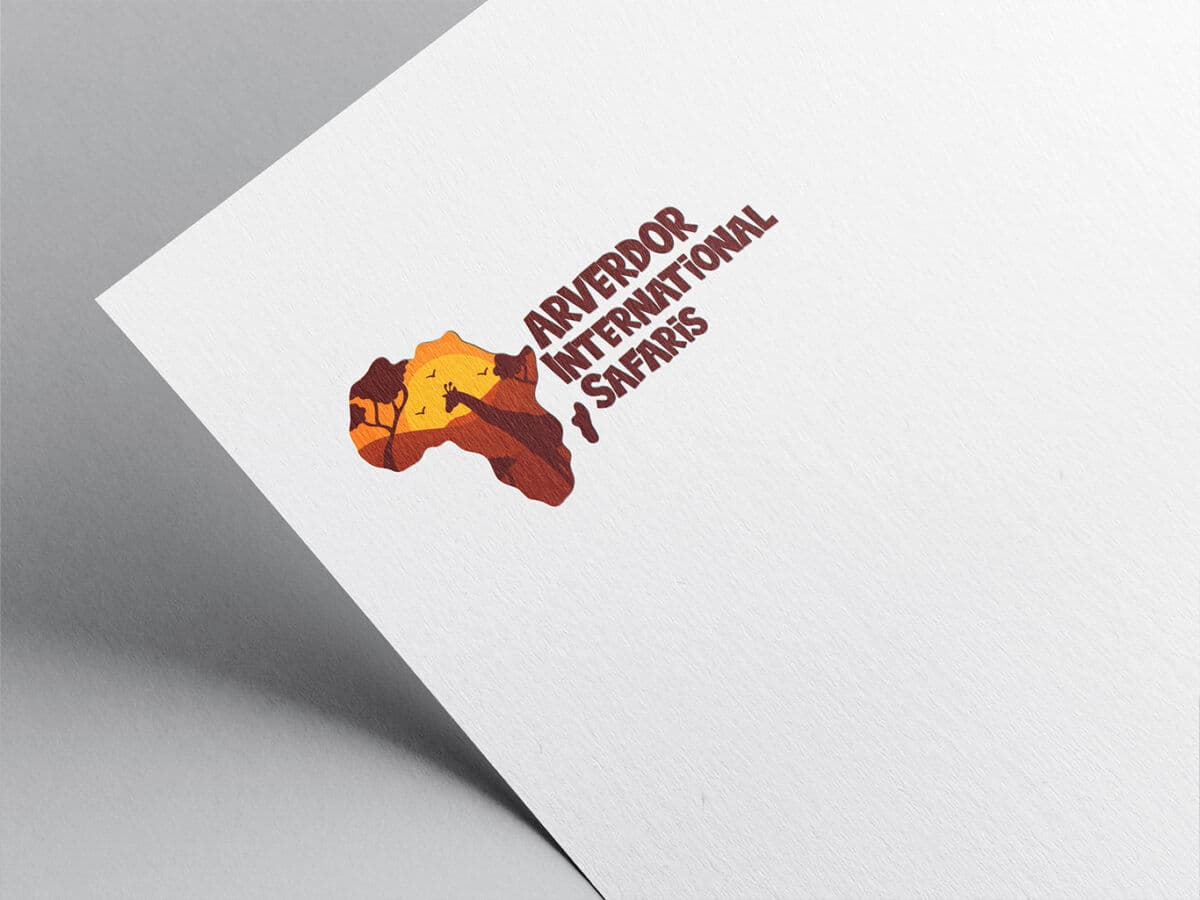 Arverdor International Safaris logo printed on paper — the African continent filled with a sunset, an acacia tree and birds, beside hand-lettered type.