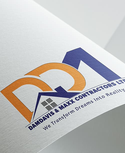 DamDavis & Maxx Contractors logo printed on paper — an orange D and blue M locked around a rooftop and window, above the line “We Transform Dreams Into Reality”.