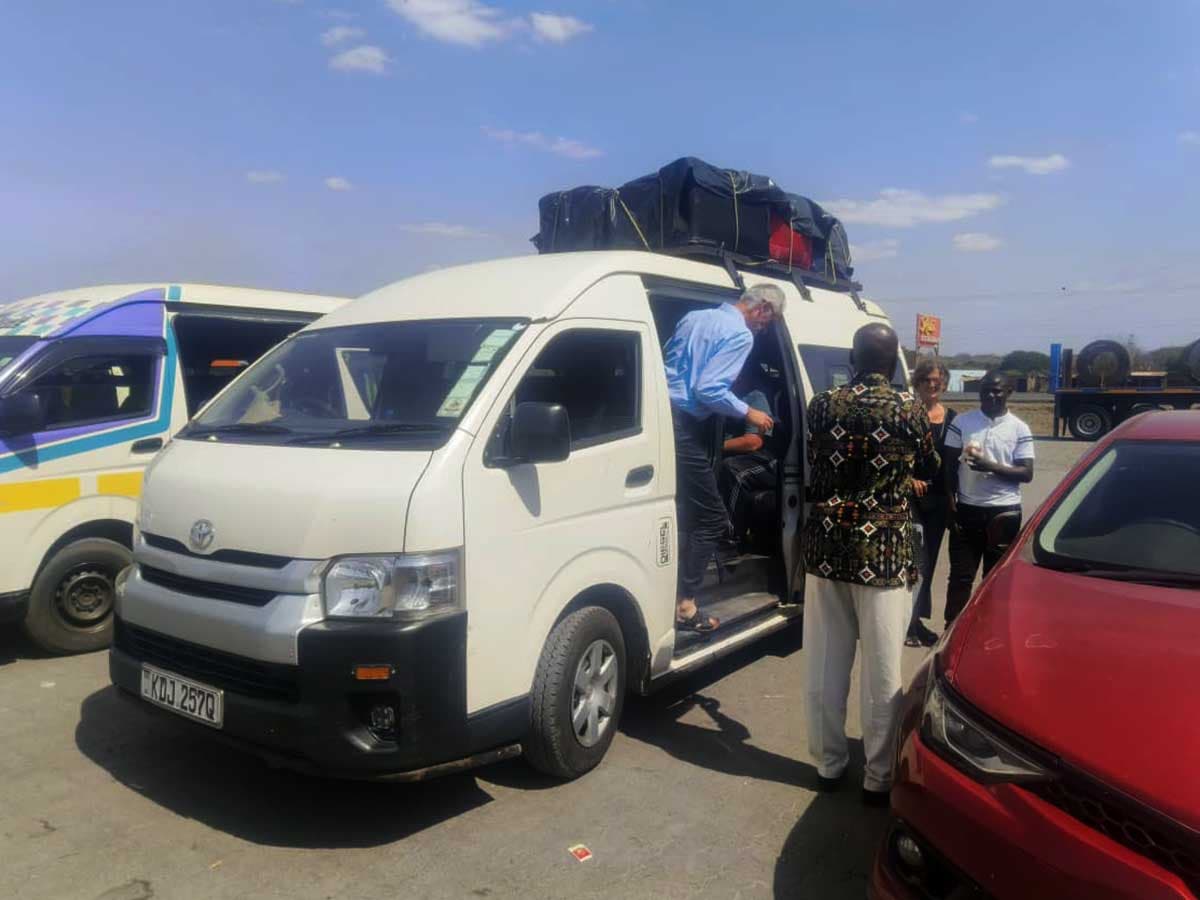 An Eliso Safaris transfer vehicle waiting for an airport pickup